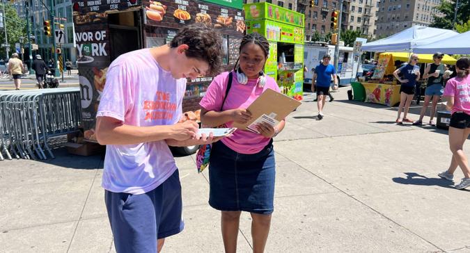 Youth Ambassador registering voters on the streets of New York City
